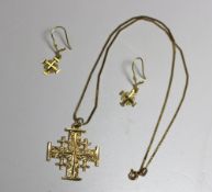 A yellow metal cross inscribed Jerusalem, 18k, with matching earrings, approximately 7 grams