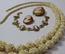 A bone necklace carved as flowers and beads together with two cameo brooches and a cameo bracelet