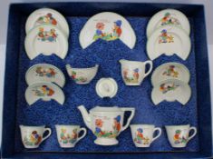 An Amersham decorated pottery tea set, decorated with nursery rhymes, four cup set with plates (