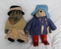 A Paddington Bear with blue felt hat and coat, with label and Dunlop Wellington boots, together with