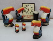A Guinness Time toucan pottery clock together with Toucan salt and pepper, Guinness jugs, Guinness