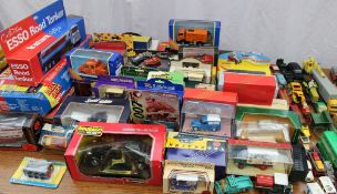 A large collection of boxed and unboxed toy cars including Dinky, Maisto, Days Gone etc, together