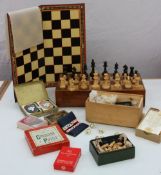 A turned treen chess set together with chess boards, cards etc