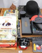 Assorted Giles Annuals together with song books, rugby programmes, bowler hat, cigarette cards,