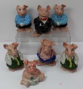 A set of five Wade Natwest piggy banks together with an additional mother and daughter