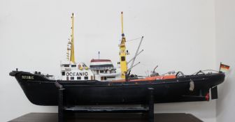 A model of the Oceanic with lifeboats on a shaped base, together with a model of the yacht Collie