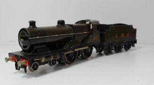 A Bassett-Lowke 4-4-0 `O` gauge electric L.M.S locomotive and tender, No. 1063, in brown livery, (