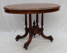 A Victorian burr walnut supper table, the quarter veneered top on a four column base and four
