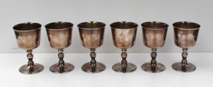 A set of six Elizabeth II silver pedestal goblets, the flared bowl above an inverted baluster stem
