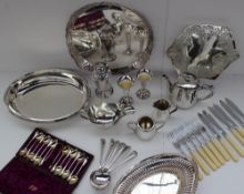 An electroplated circular tray together with a sauce boat, entree dish, bud vases etc