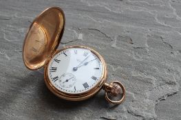 A 9ct yellow gold full hunter pocket watch, the enamel dial with Roman numerals and seconds