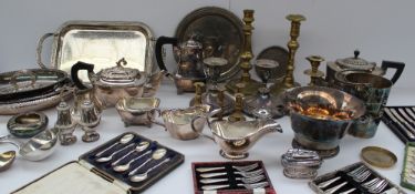 A pair of electroplated candlesticks together with a part tea set, cased flatwares, brass