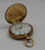 A yellow metal Hunter pocket watch, the case engraved with stars and scrolls, the case marked ``LB,