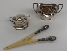 A late Victorian silver twin handled sugar bowl of lobed form, Birmingham, 1898, together with a
