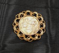 An Edward VII gold sovereign dated 1910 in a yellow metal slip mount