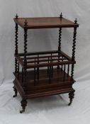 A Victorian rosewood Canterbury whatnot, the rectangular top with turned finials and barley twist