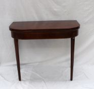 A 19th century mahogany card table, the hinged ``D`` shaped top above a shallow frieze on square