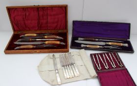 An antler handled five piece carving set with silver ends contained within an oak case, together