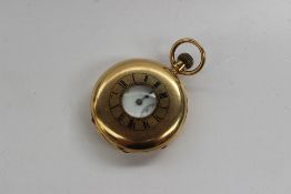 An 18ct yellow gold keyless wound half hunter pocket watch, the enamel dial with Roman numerals and