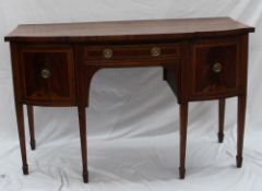 An early 19th century mahogany break front sideboard, the cross banded top above a central drawer