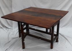 A 19th century oak gateleg dining table, the rectangular top with drop flaps on square legs, 121cm