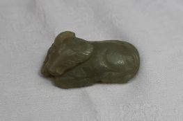 A Chinese jade carving of a recumbent buffalo, 4.5cm long