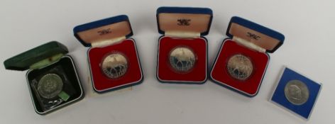 A white metal 1972 crown, three 1977 silver crowns and a 1965 Churchill crown
