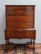 A William and Mary and later walnut chest on stand, the rectangular moulded top above two short and