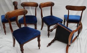 A set of six early 19th century mahogany dining chairs with a leaf carved bar back on reeded legs