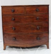 A Victorian mahogany bow fronted chest of drawers with two short and three long drawers on splayed