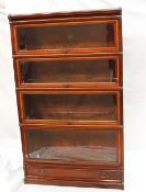 A mahogany four section Globe Wernicke bookcase with a base drawer, 86cm wide