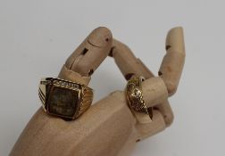 A yellow metal gentleman`s ring with an eagle head design marked 14K, together with a gentleman`s