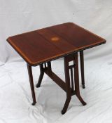 An Edwardian mahogany Sutherland table, the rectangular cross banded top on square legs united by a