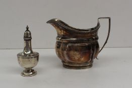A late George III silver cream jug of lobed form with a gadrooned edge, marks indistinct, together
