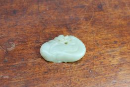 A Chinese jade carving of oval form, 4.5cm long