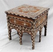 An Anglo Indian table, the square top inlaid with ebony and ivory, profusely adorned with scrolls,