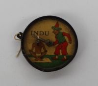 A German toy depicting a beheading marked "Indu" of circular form