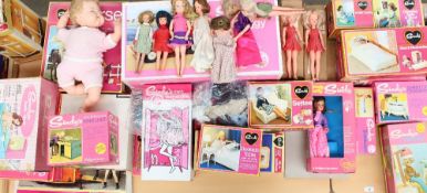 A large collection of Sindy dolls and accessories from the 1970s including Fun Buggy, armchair,
