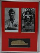 A framed black and white photograph and a signed sheet for Duncan Edwards