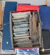 A large collection of first day covers in ring binders together with post office postcards, and