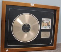 A "My collectables" certified gold compact disc award for "Queen, The Works" framed and glazed