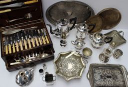 Assorted electroplated items including a part tea set, swing handled cake basket, cased flatware