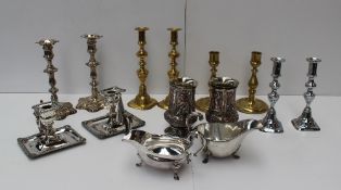 A pair of electroplated chamber sticks together with a pair of candlesticks, a pair of Elkington