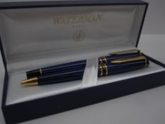A Waterman expert duo set, comprising fountain pen in blue with yellow metal and black band