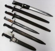 An American M1 bayonet together with five other bayonets.