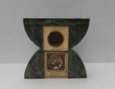 A Troika double Anvil vase decorated with geometric patterns and circles to a green ground, signed