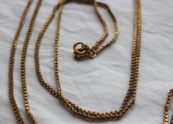 A yellow metal long chain marked 9c, approximately 25 grams,
