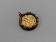 A late Victorian gold half sovereign dated 1895, in a 9ct yellow gold slip mount