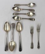 A pair of George III silver table spoons, London, 1789, together with another silver table spoon,