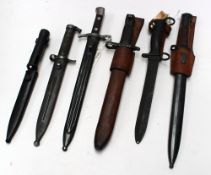 A Finnish Mosin Nagant bayonet and scabbard together with five other bayonets.